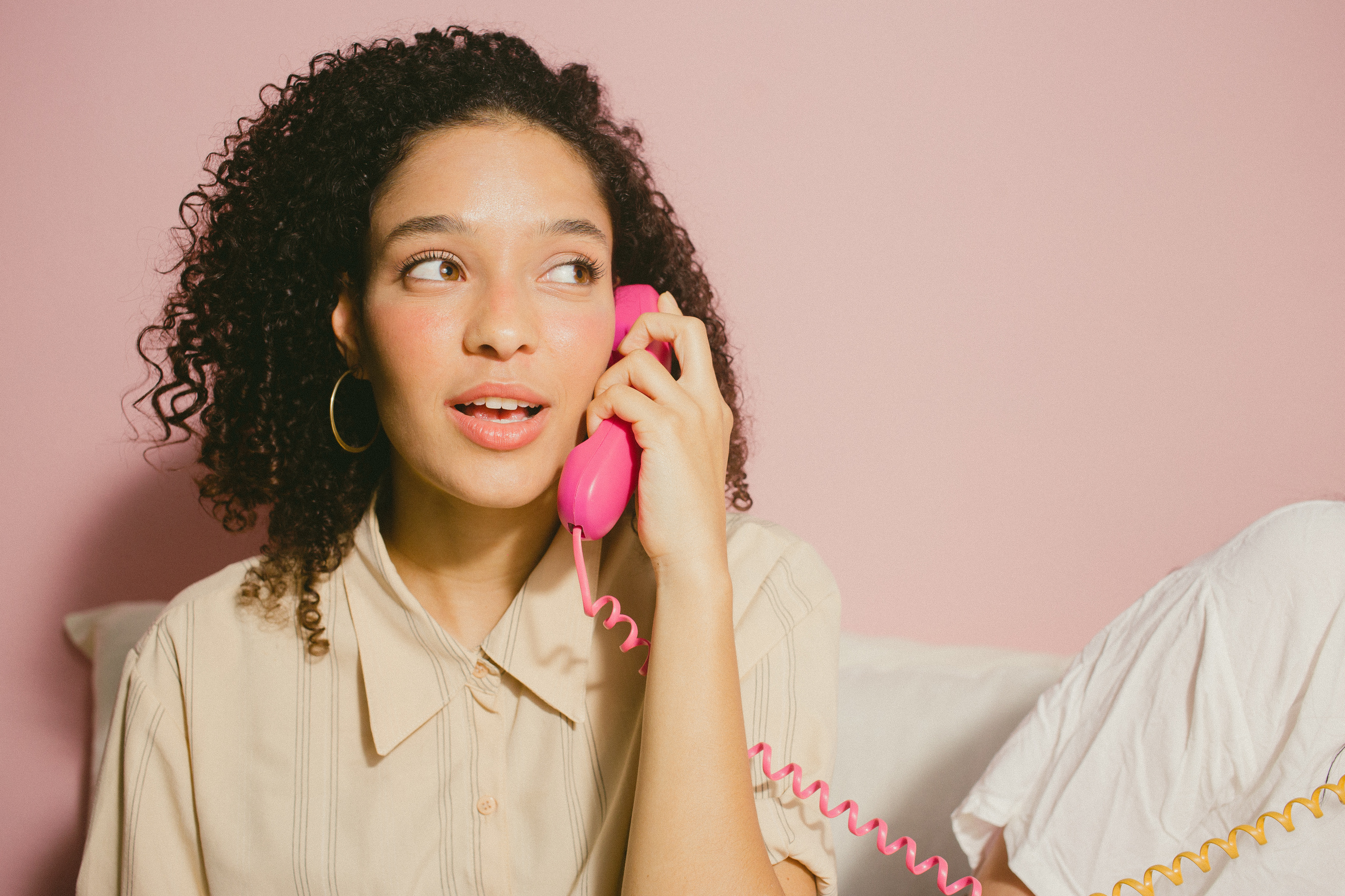 Woman Calling with a Pink Phone 